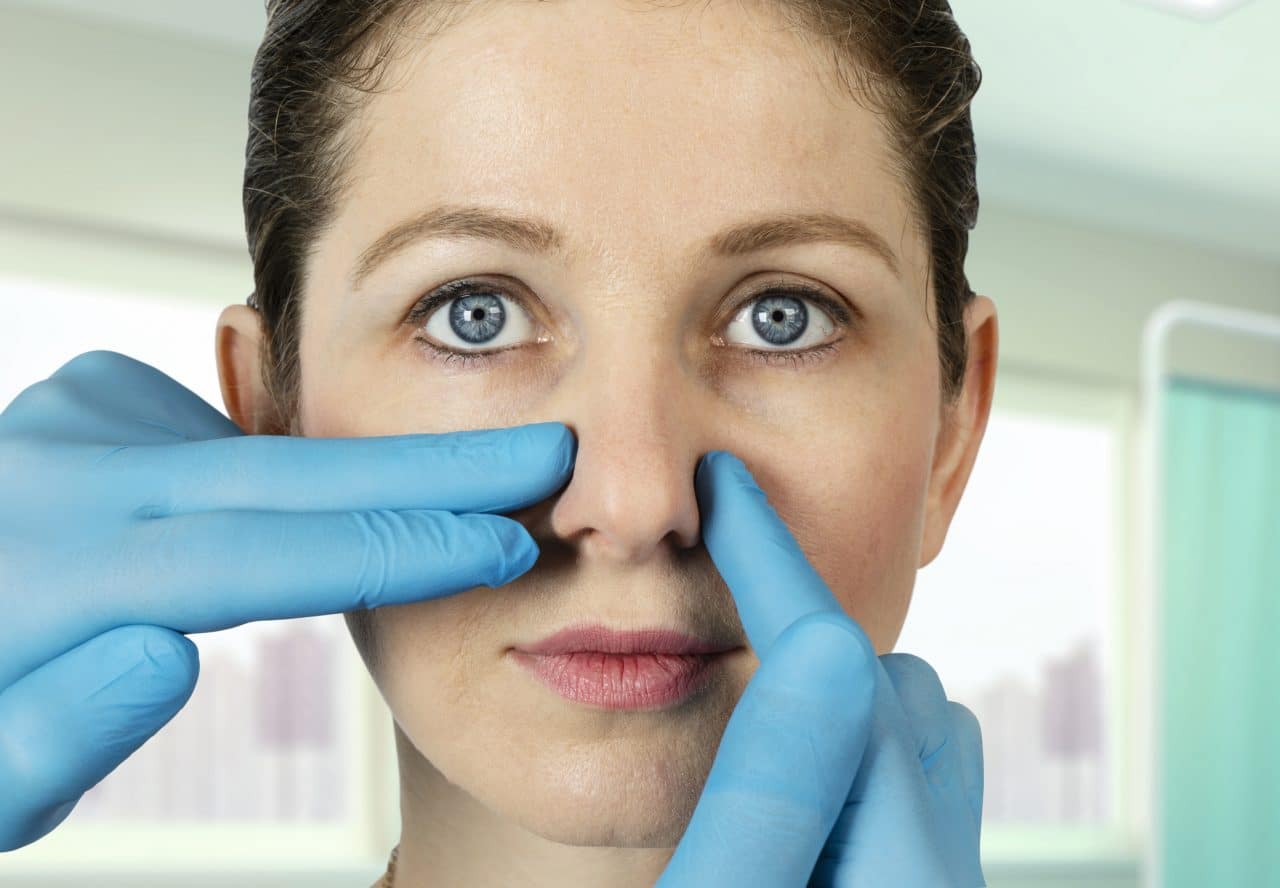 Woman being examined for nasal surgery