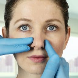 Woman being examined for nasal surgery