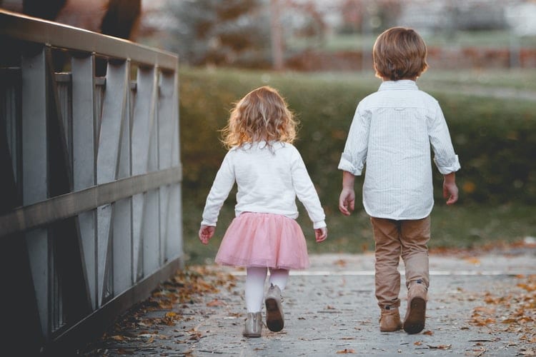 Children walking on a bridge