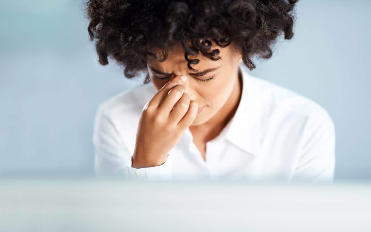 A woman suffering from allergies.