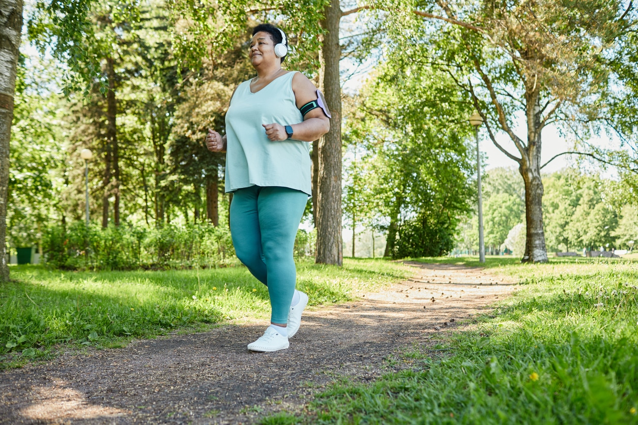 Woman walking through the park