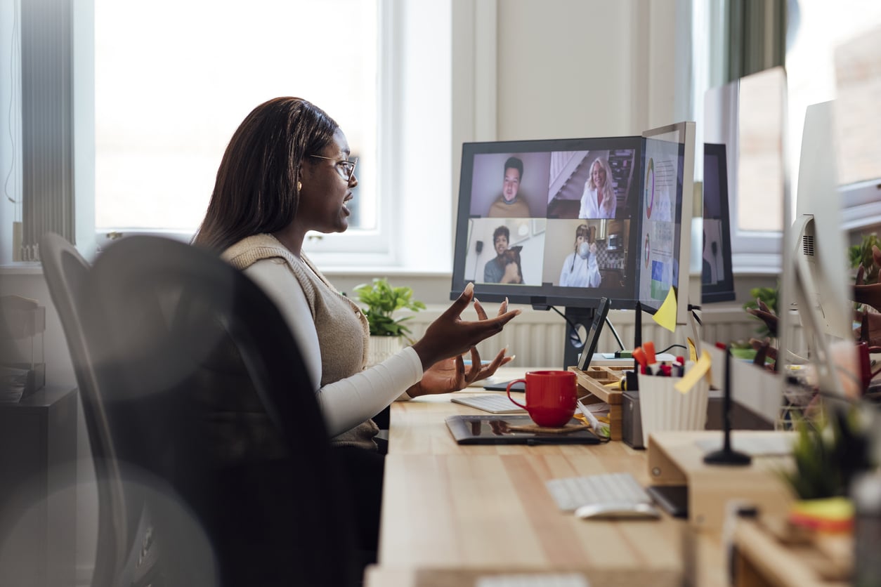 Woman video conferencing from her home office.